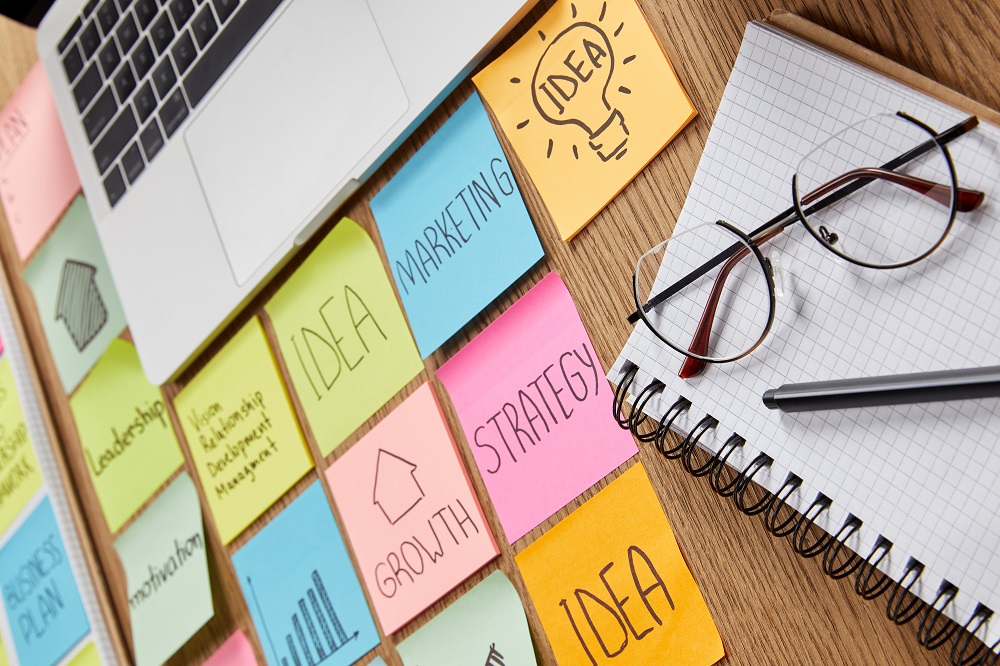 paper stickers with business strategy, laptop and notebook with pencil on tabletop Mindboggling statistics